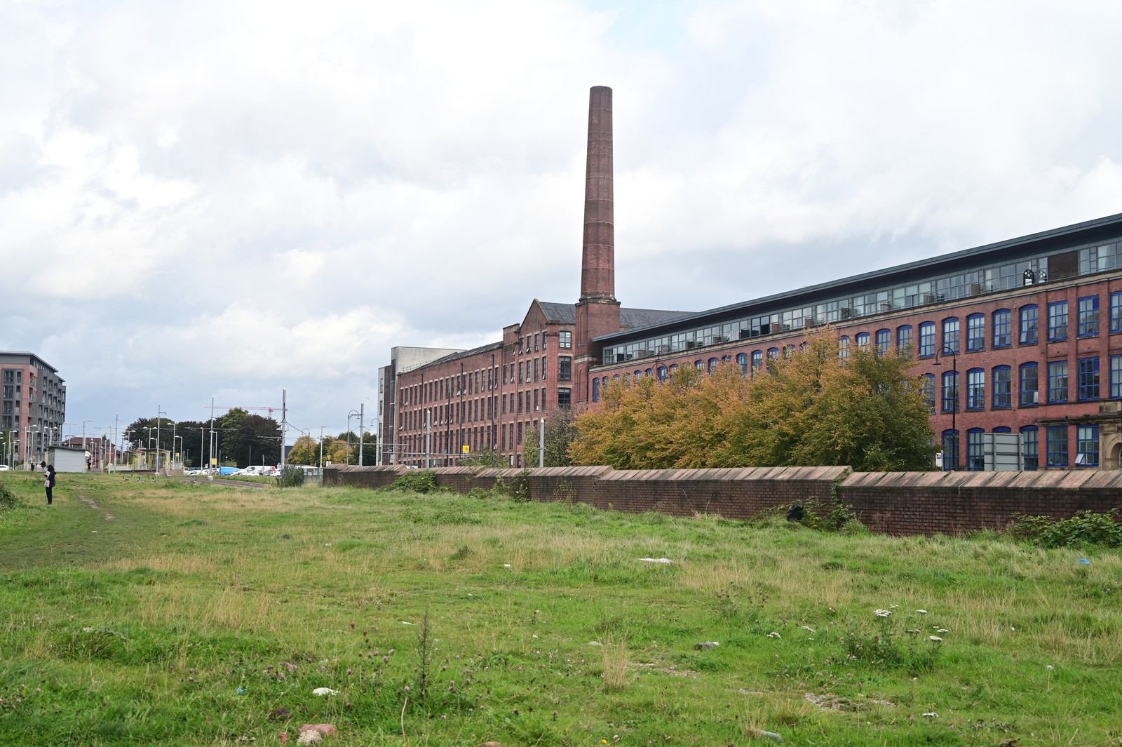 Open ground before the former cotton mill