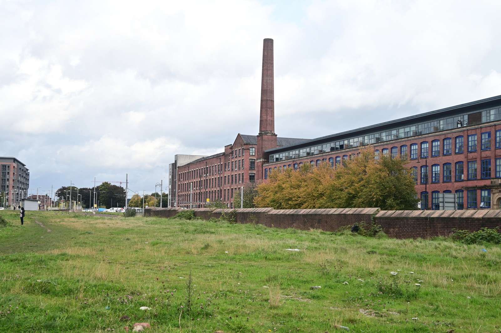 Open ground before the former cotton mill